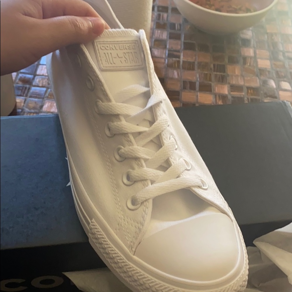 Brand new, One black and one white converse